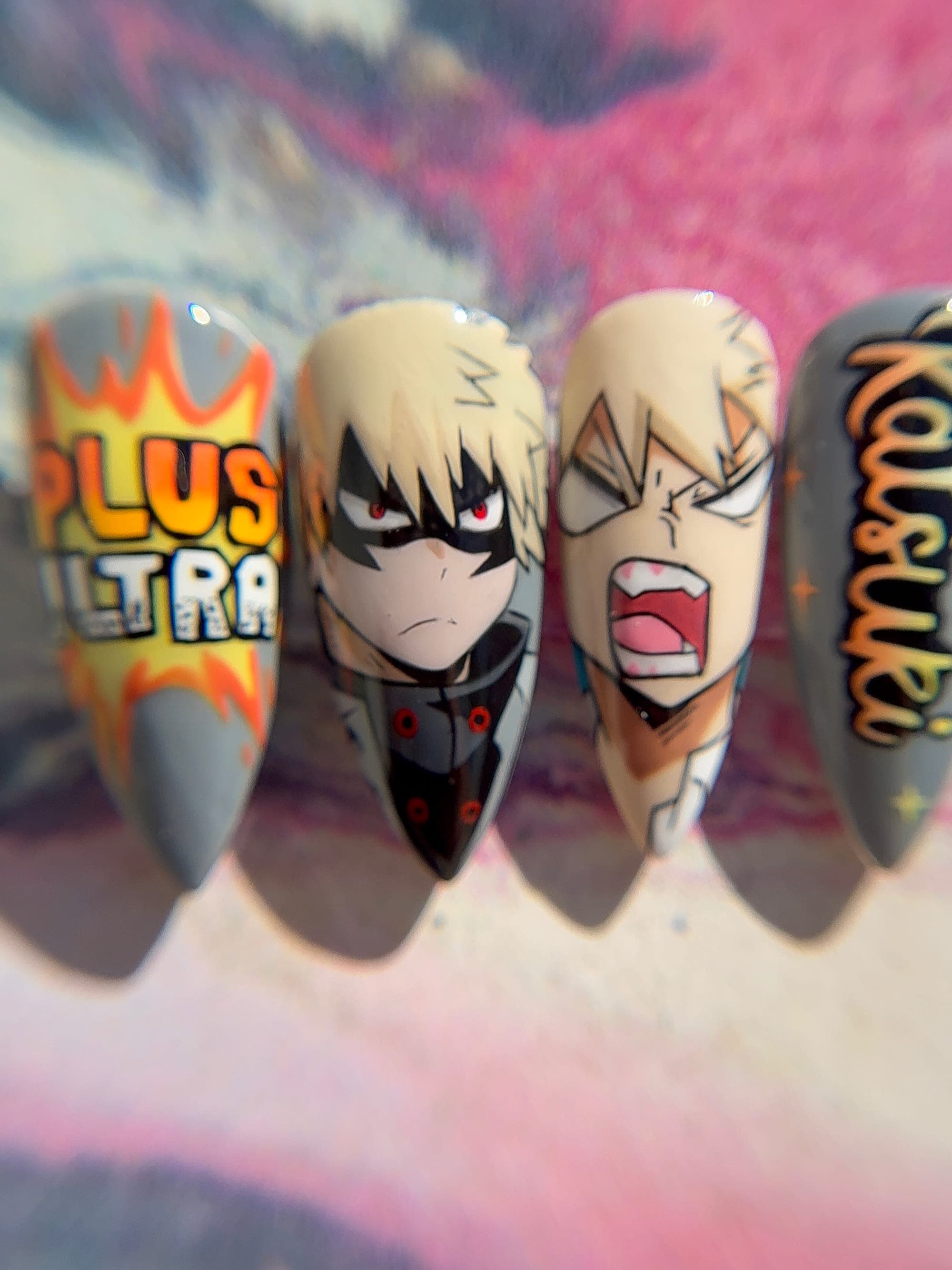 Macro of Bakugo nails with “Plus Ultra” lettering