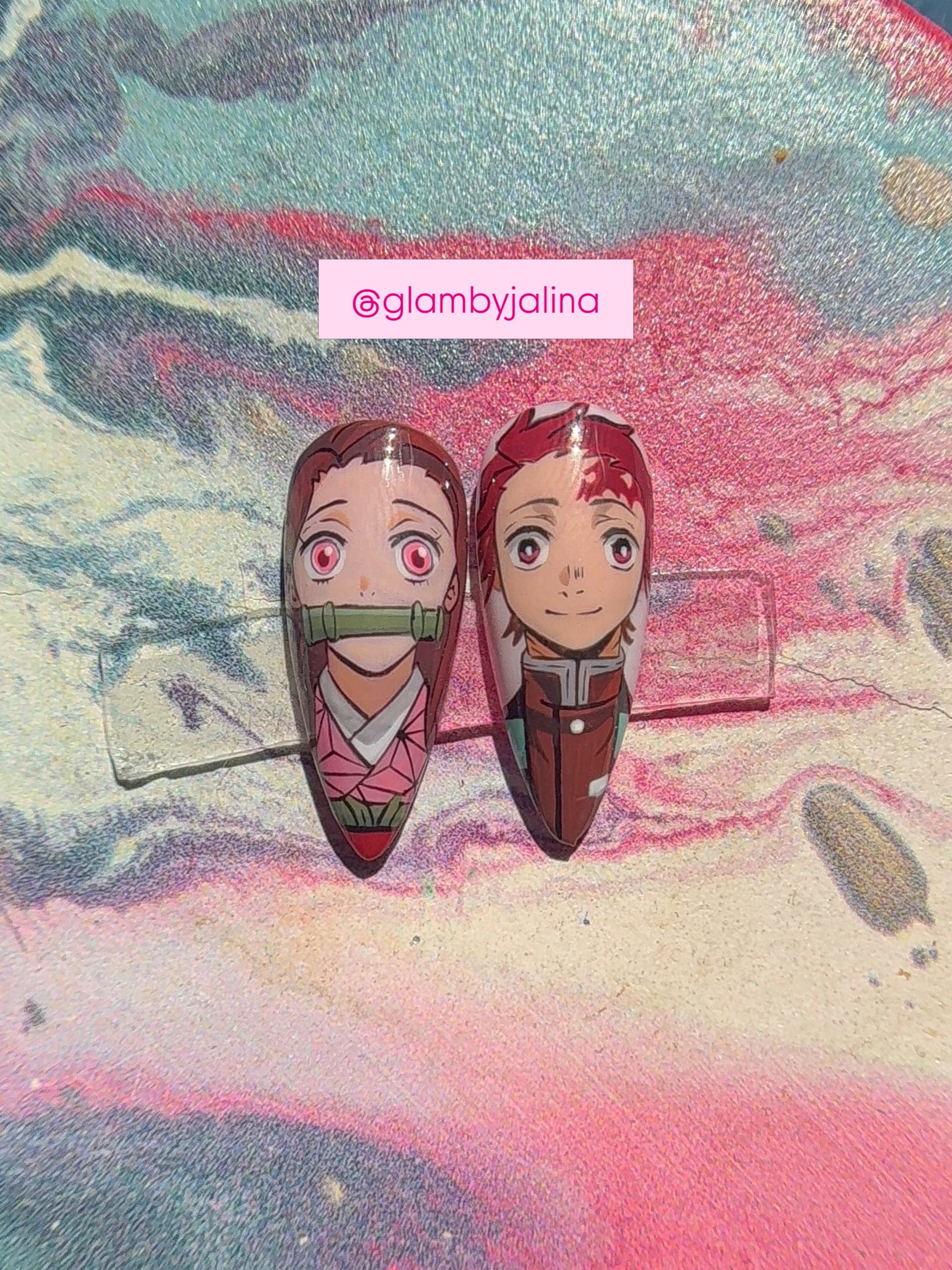 Tanjiro and Nezuko portrait nails on a marbled tray